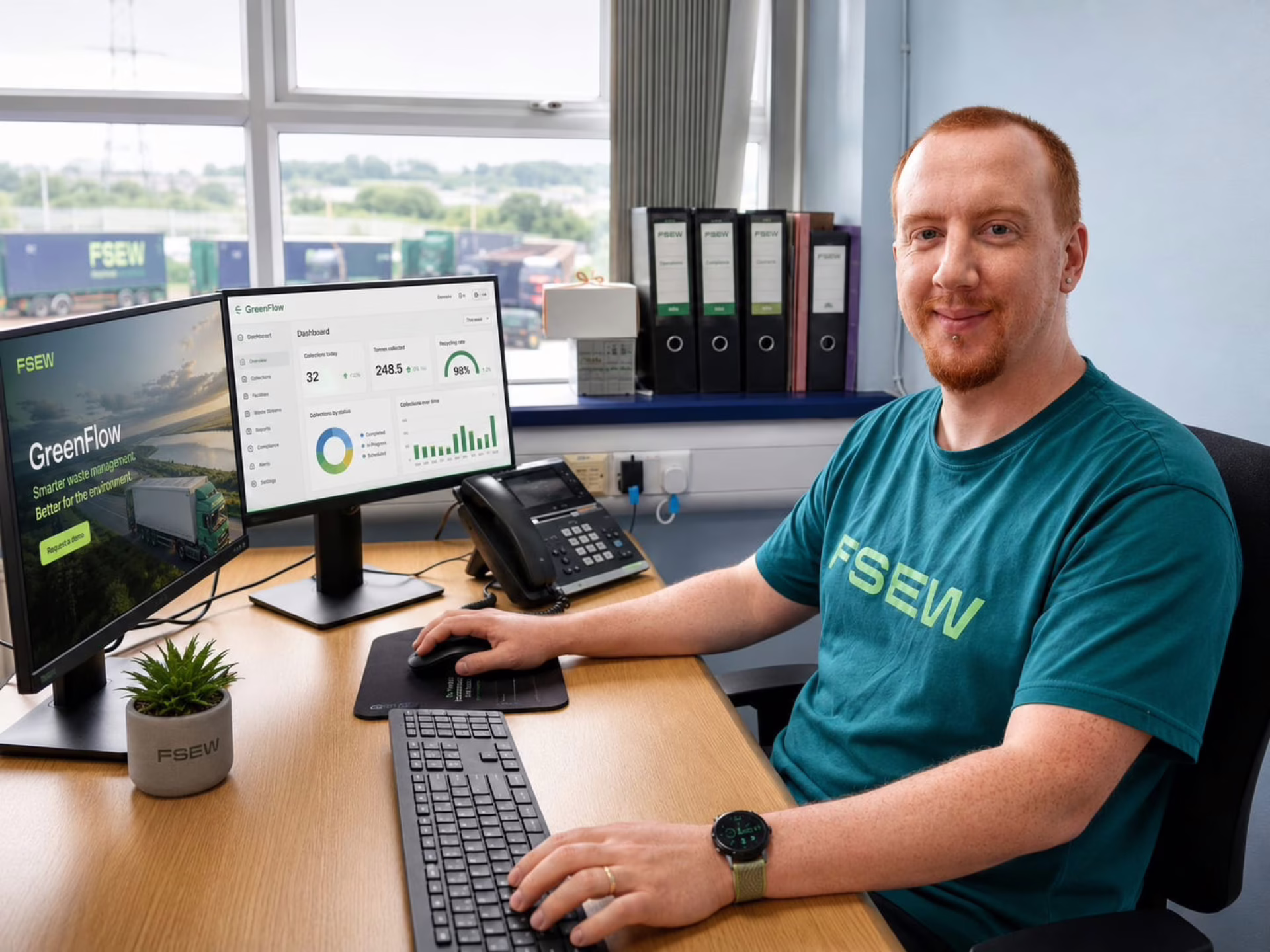 James Perry, Business & Sustainability Analyst for FSEW sitting at his desk.